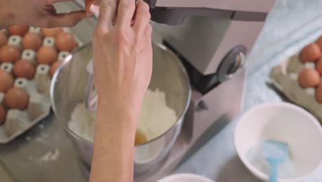Crop-baker-preparing-dough-in-kitchen