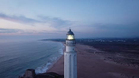 Lighthouse-on-cape-near-sea