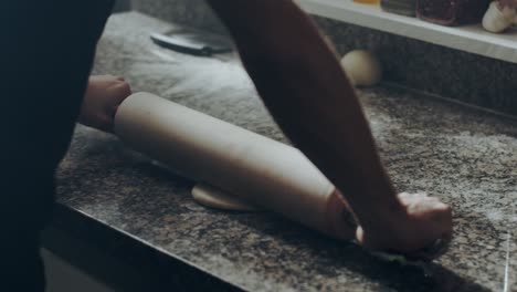 Anonymous-chef-rolling-dough-for-pastry