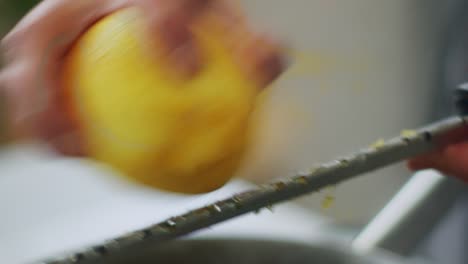 Woman-adding-lemon-zest-to-stewing-ossobuco