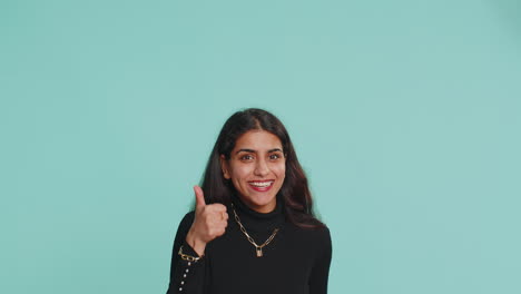 Indian-woman-showing-thumbs-up-pointing-empty-place,-advertising-area-for-commercial-text-copy-space