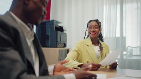 Two-successful-businessmen-black-woman-and-black-man-wear-suits-salesman-banker-manager-handshake-happy-client-customer-investor-at-business-meeting-make-bank-loan-insurance-investment-deal-agreement