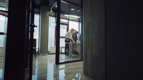 business-meeting-of-multiracial-team-of-financial-and-marketing-specialists-camera-moves-in-office