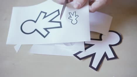 scissors-cutting-different-paper-silhouettes-for-April-fools-day