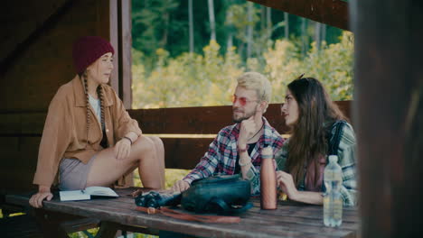 Woman-Sitting-On-Bench-While-Talking-To-Friends