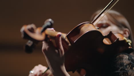 violin-in-hands-of-young-woman-musician-is-playing-fiddle-classic-or-neoclassic-music-in-concert