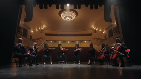 violinists-violoncellists-bassoonist-and-flutist-are-playing-classic-or-neo-classical-music-in-philharmonic-hall