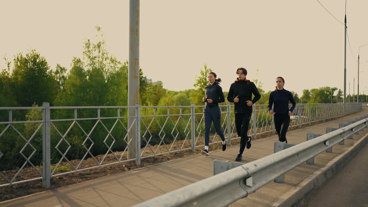 Three Students Are Running In Morning Jog For Keeping Fit And Good ...