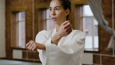 Young-woman-practising-in-a-dojo