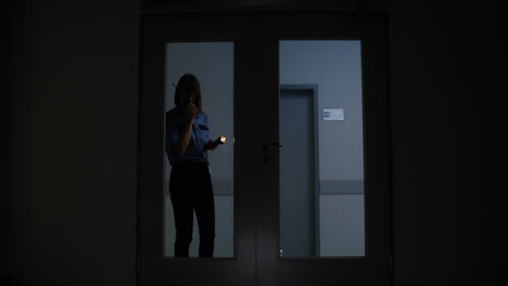 Woman-in-uniform-searching-on-the-hallway