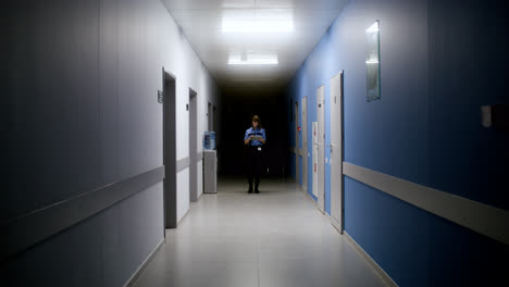 Woman-in-uniform-searching-on-the-hallway