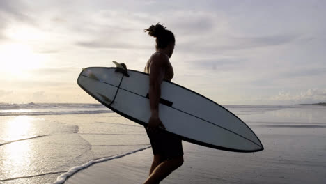 Young-man-with-surfboard