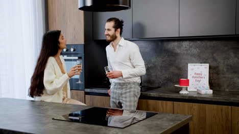 Young-couple-kissing-on-the-kitchen