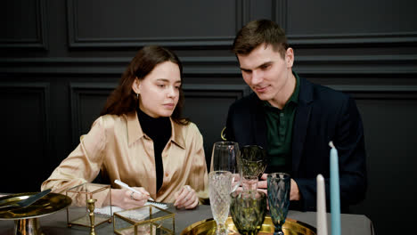 Couple-sitting-at-elegant-table