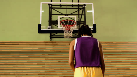 Sporty-girl-in-basketball-court