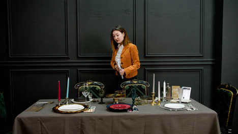 Asian-woman-organizing-ornaments-on-a-table