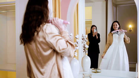 Asian-and-caucasian-woman-in-wedding-dress-shop