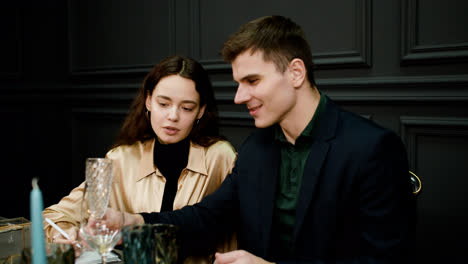 Couple-sitting-at-elegant-table