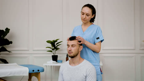 Man-receiving-a-head-massage
