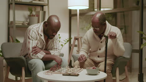 Black-men-playing-chess-in-the-living-room