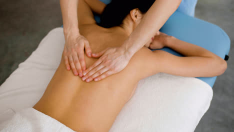 Physiotherapist-giving-a-back-massage