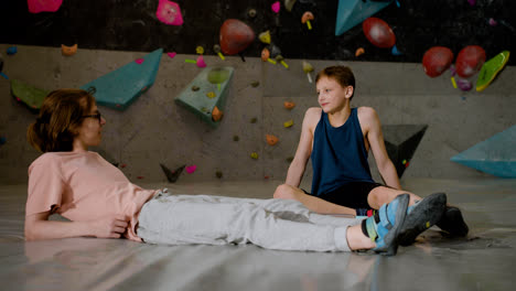 Boys-resting-in-a-climbing-gym