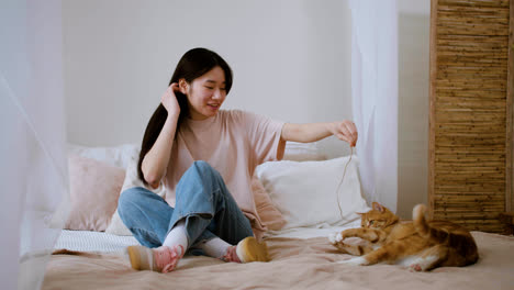 Woman-playing-with-cat