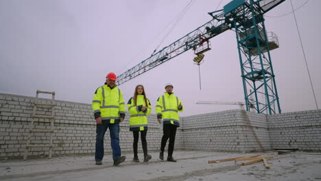 group-of-building-inspectors-in-construction-site-female-architect-and-male-civil-engineers
