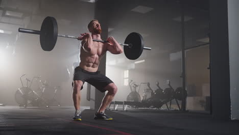 Athletic-Beautiful-man-Does-Overhead-Deadlift-with-a-Barbell-in-the-Gym.-Gorgeous-male-Professional-Bodybuilder-Workout-Weight-Lift-Exercises-in-the-Authentic-Fit-Training-Facility