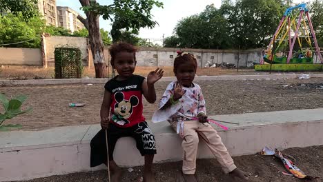 Two-laborer's-children-are-looking-at-the-camera-and-saying-hi-and-he-is-very-happy