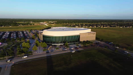 Drone-shot-circling-the-Smart-Financial-Centre-at-Sugar-Land,-sunny-evening-in-Texas,-USA