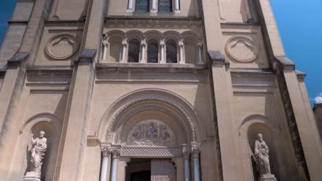 Slow-motion-tilting-shot-of-tourists-exploring-the-Roman-Catholic-Diocese-of-Uzès