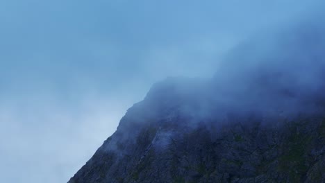 Cloudscape-Covering-Jagged-Mountain-In-Gryllefjord-Village-In-Senja-Island,-Norway