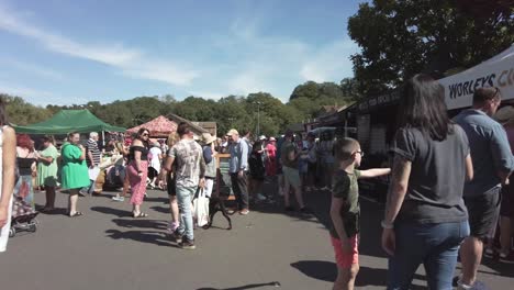 Tourists-wonder-through-a-Sunday-market-in-a-small-English-town