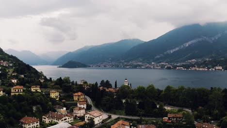 Drone-shot-over-Bellagio,-Italy-with-Lake-Como-in-the-distance