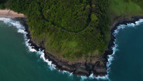 Aerial-shot-flying-from-a-the-cliffs-of-a-Thailand-island-out-to-the-ocean