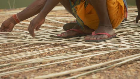 South-Asian-carpenters-weaving-the-bamboo-roof,-Bamboo-weaving,-closeup