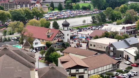 FRANKENMUTH,-MI---September-10,-2023---A-zoomed-rotating-aerial-view-of-downtown-Frankenmuth-Michigan-during-the-Auto-Fest-of-2023