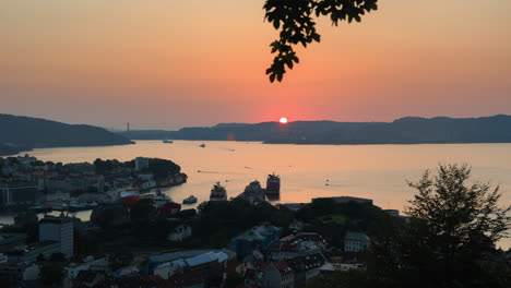Beautiful-orange-sunset-over-Bergen-in-day-to-night-timelapse