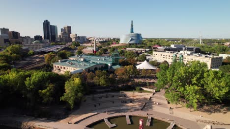 Cinematic-aerial-of-the-Forks-Waterfront-in-Downtown-Winnipeg,-4K