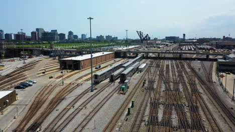 Aerial-view-of-trains-at-the-AMTRAK-Chicago-Car-Yard,-sunny-day-in-Illinois-USA