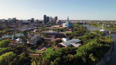 Gorgeous-aerial-of-The-Forks-and-Winnipeg-skyline,-summer-2023