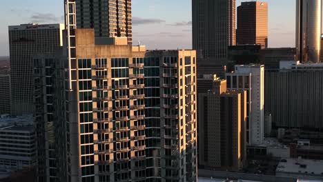 Sunset-light-falling-on-the-building-exterior,-Downtown-Atlanta-skyline-buildings-at-sunset,-Aerial-View