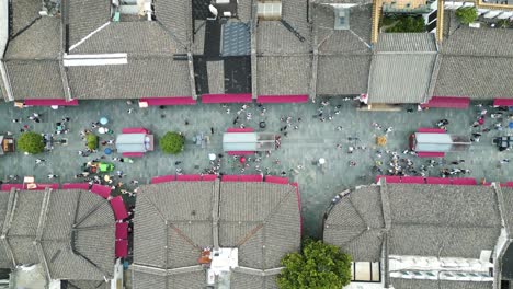 Top-down-aerial-shot-of-people-walking-through-the-historical-Qinghefang-street