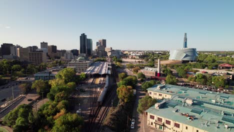 Aerial-of-Via-Rail-train-entering-Union-Station-in-Winnipeg,-MB