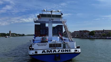 The-container-vessel-the-Amazone-on-the-calm-water-of-the-Oude-Maas,-aerial