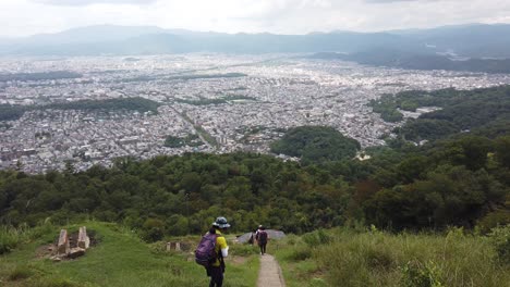 Japanese-People-Climb-Daimonji-Mount-Peak-Viewpoint-Landscape-City,-Kyoto-Japan