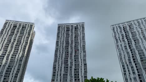 Low-angle-shot-of-tall-residential-buildings-called-Urabana-Towers-in-Kolkata,-India-on-a-cloudy-day