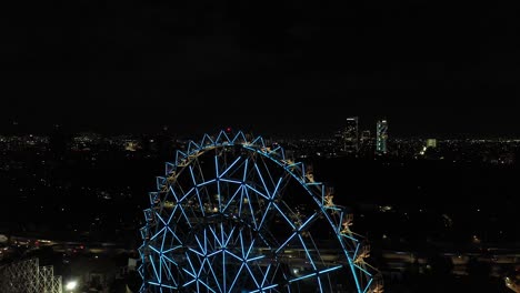 Aerial-close-up-of-the-new-Ferris-Wheel-in-Aztlan,-Parque-Urbano