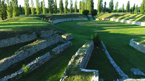 Ruins-Of-The-Ancient-Roman-Theater-In-Carnuntum,-Austria---drone-shot